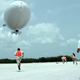 Handlers from the Airship Management Services race toward a Skyship 600 blimp as it prepares to touch down at Naval Air Station Key West, Florida in this handout photo provided by the U.S. Navy and taken on June 27, 2008. Helium, known for making the voice squeaky after it is inhaled from party balloons, but it is also a vital element in industries from aerospace and defence, to smart phones and flat-screen TVs, medical equipment and deep-sea diving tanks. The U.S. Federal Helium Reserve has been providing around a third of global crude helium and 40 percent of U.S. supply. But this will be turned off after October 7 unless Congress acts to extend its life. Picture taken June 27, 2008.